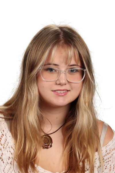 A young woman with blonde hair and clear-framed glasses.
