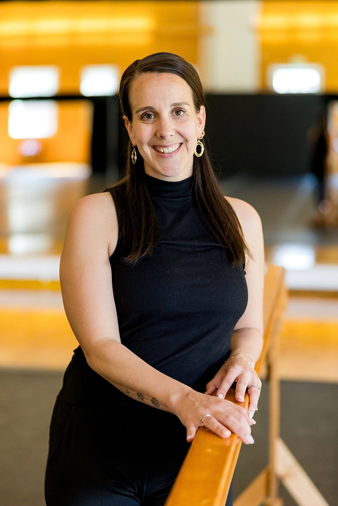 MPS Director of Dance Tessa Hailu standing at the barre in the middle of the dance studio