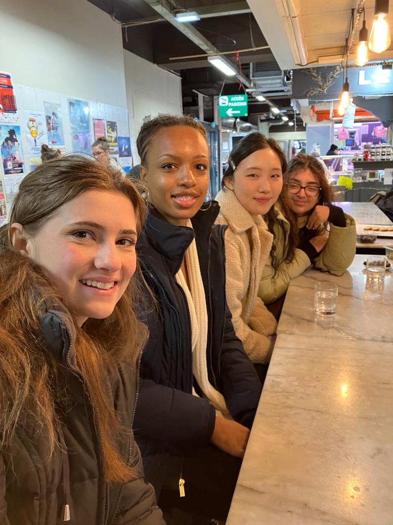 students sitting at a market restaurant